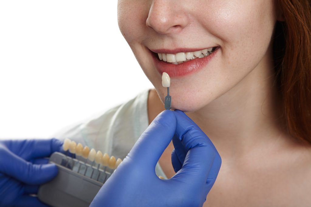 a woman is getting dental treatment