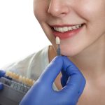 a woman is getting dental treatment