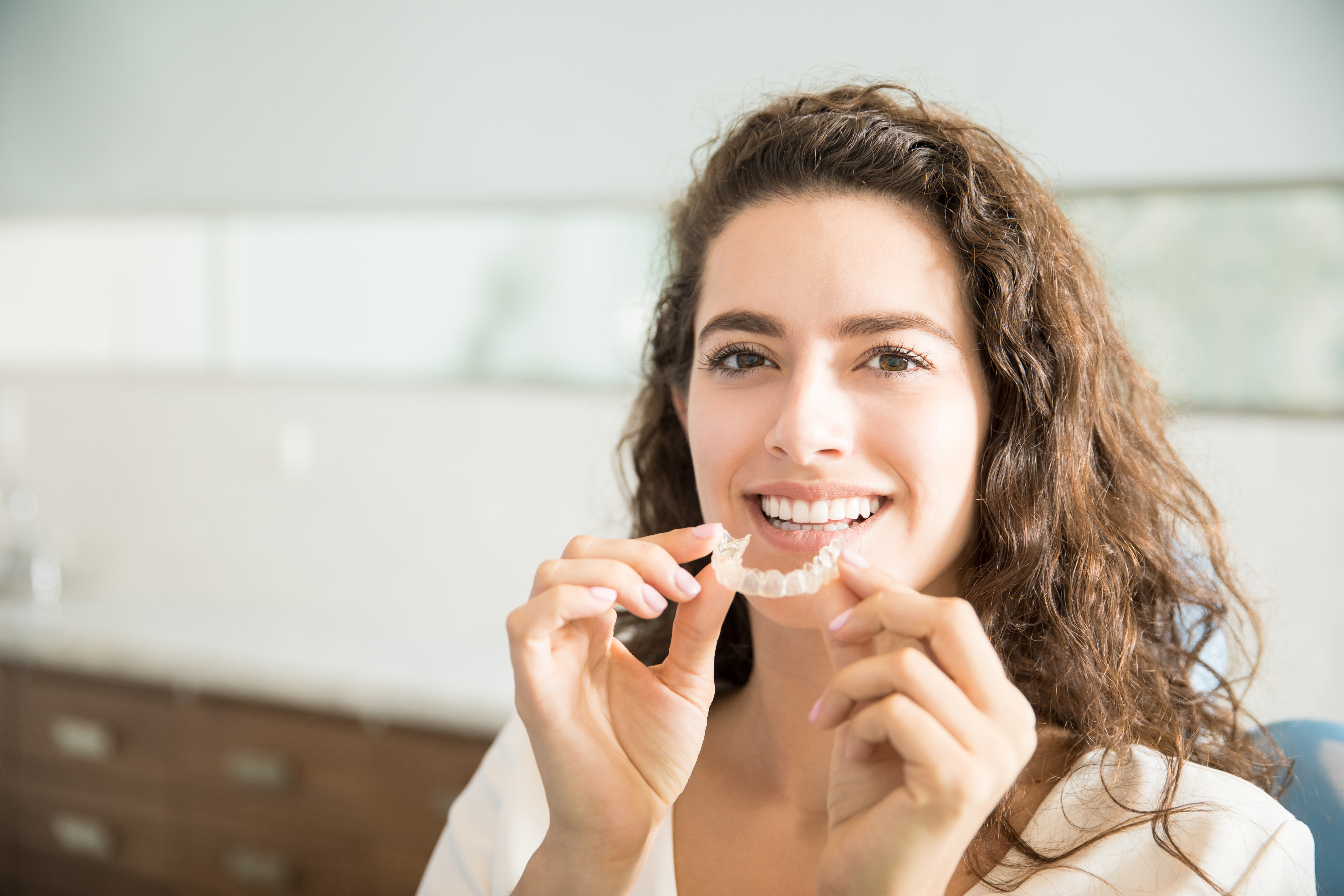 a woman is getting dental treatment